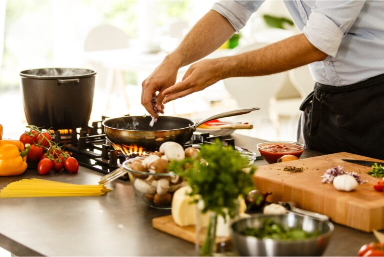 Man making food (Canva)